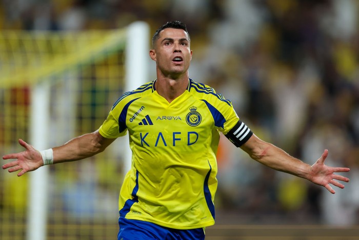 RIYADH, SAUDI ARABIA - AUGUST 22: Cristiano Ronaldo of Al Nassr celebrating after scores the 1st goal during the Saudi Pro League match between Al Nassr and Al Raed at Al Awwal Park Stadium on August 22, 2024 in Riyadh, Saudi Arabia. (Photo by Yasser Bakhsh/Getty Images)