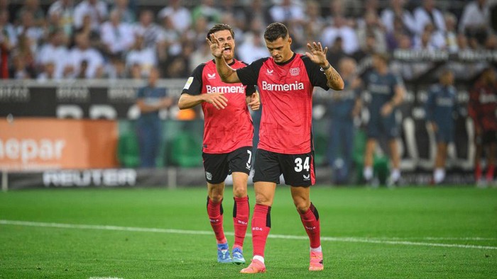Granit Xhaka MOENCHENGLADBACH, GERMANY - AUGUST 23: Granit Xhaka of Leverkusen celebrates after scoring his teams first goal during the Bundesliga match between Borussia MΓΆnchengladbach and Bayer 04 Leverkusen at Borussia-Park on August 23, 2024 in Moenchengladbach, Germany. (Photo by JΓΆrg SchΓΌler/Bayer 04 Leverkusen via Getty Images)