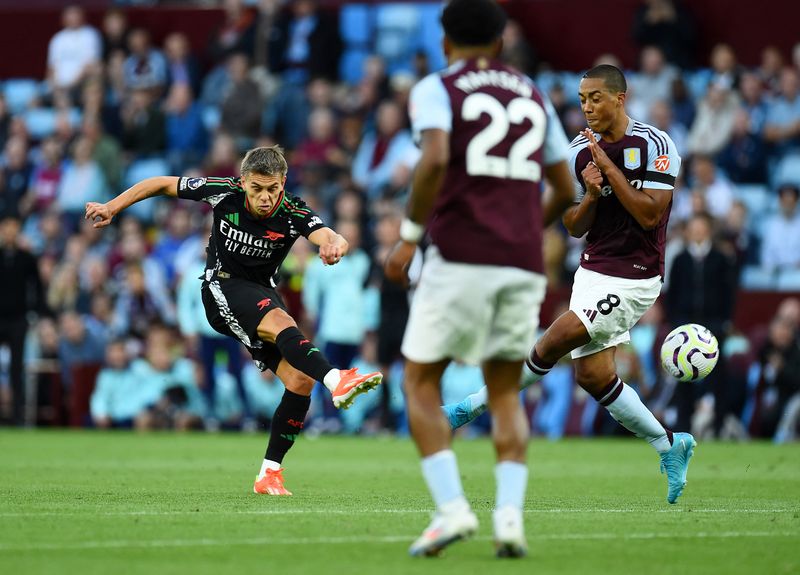 Soccer Football - Premier League - Aston Villa v Arsenal - Villa Park, Birmingham, Britain - August 24, 2024 Arsenal's Leandro Trossard shoots at goal REUTERS/Peter Powell EDITORIAL USE ONLY. NO USE WITH UNAUTHORIZED AUDIO, VIDEO, DATA, FIXTURE LISTS, CLUB/LEAGUE LOGOS OR 'LIVE' SERVICES. ONLINE IN-MATCH USE LIMITED TO 120 IMAGES, NO VIDEO EMULATION. NO USE IN BETTING, GAMES OR SINGLE CLUB/LEAGUE/PLAYER PUBLICATIONS. PLEASE CONTACT YOUR ACCOUNT REPRESENTATIVE FOR FURTHER DETAILS..