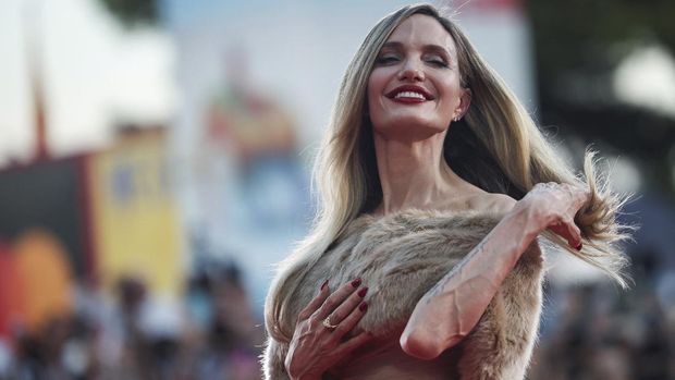 Actor Angelina Jolie poses on the red carpet during arrivals for the screening of the movie 