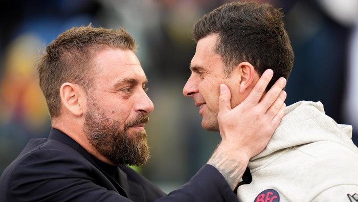 Thiago Motta head coach of Bologna FC greets Daniele De Rossi head coach of AS Roma during the Serie A TIM match between AS Roma and Bologna FC at Stadio Olimpico on April 22, 2024 in Rome, Italy. (Photo by Giuseppe Maffia/NurPhoto via Getty Images)