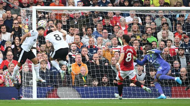  Luis Diaz of Liverpool scores his team's first goal past Andre Onana of Manchester United during the Premier League match between Manchester United FC and Liverpool FC at Old Trafford on September 01, 2024 in Manchester, England. (Photo by Michael Regan/Getty Images)