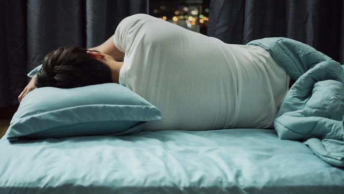 Man sleeping in bed at night
