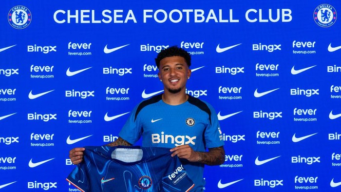 COBHAM, ENGLAND - AUGUST 30: Jadon Sancho poses for pictures as he signs for Chelsea Football Club at Chelsea Training Ground on August 30, 2024 in Cobham, England. (Photo by Chris Lee - Chelsea FC/Chelsea FC)