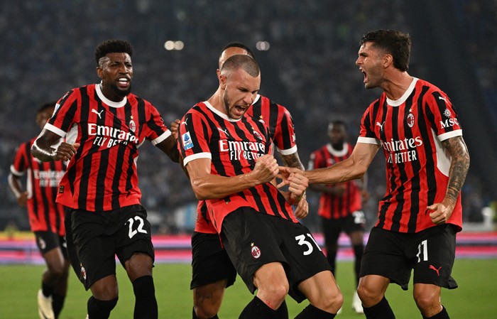 Tammy Abraham, AC Milan Soccer Football - Serie A - Lazio v AC Milan - Stadio Olimpico, Rome, Italy - August 31, 2024 AC Milan's Strahinja Pavlovic celebrates scoring their first goal REUTERS/Alberto Lingria