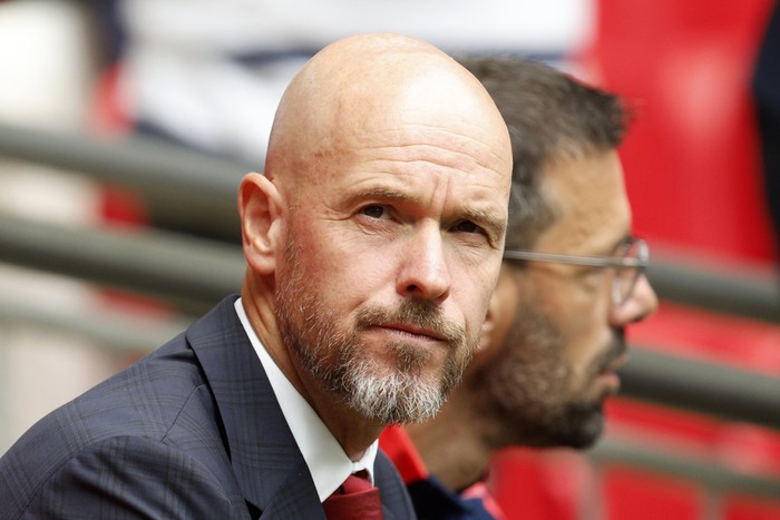 Manchester United manager Erik ten Hag watches his team during the FA Community Shield final soccer match between Manchester City and Manchester United at Wembley Stadium in London, Saturday, Aug. 10, 2024. (AP Photo/David Cliff)