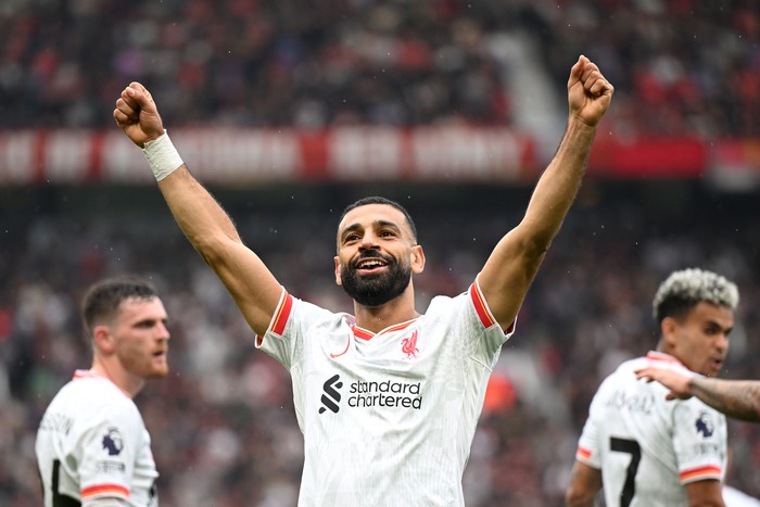 Mohamed Salah MANCHESTER, ENGLAND - SEPTEMBER 01: Mohamed Salah of Liverpool celebrates scoring his team's third goal during the Premier League match between Manchester United FC and Liverpool FC at Old Trafford on September 01, 2024 in Manchester, England. (Photo by Michael Regan/Getty Images)