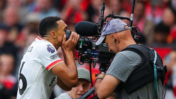 MANCHESTER, ENGLAND - SEPTEMBER 01: Trent Alexander-Arnold of Liverpool celebrates after scoring a goal by kissing a steadicam TV Camera, which was later ruled out for offside, following a VAR review during the Premier League match between Manchester United FC and Liverpool FC at Old Trafford on September 01, 2024 in Manchester, England. (Photo by James Gill - Danehouse/Getty Images)