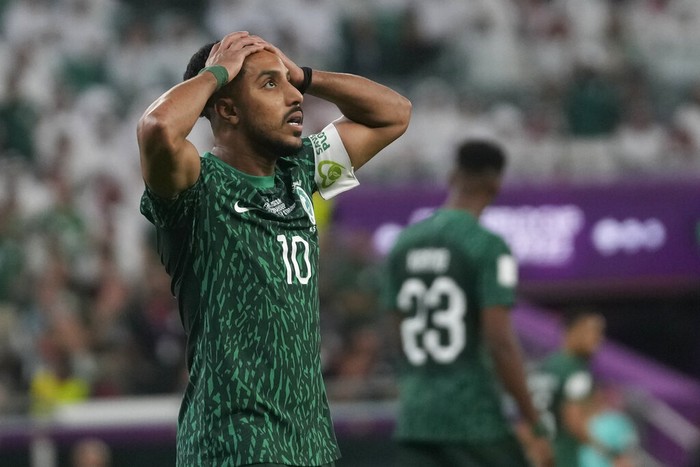Saudi Arabias Salem Al-Dawsari holds his head after missing a chance to score during the World Cup group C soccer match between Poland and Saudi Arabia, at the Education City Stadium in Al Rayyan , Qatar, Saturday, Nov. 26, 2022. (AP Photo/Darko Vojinovic)