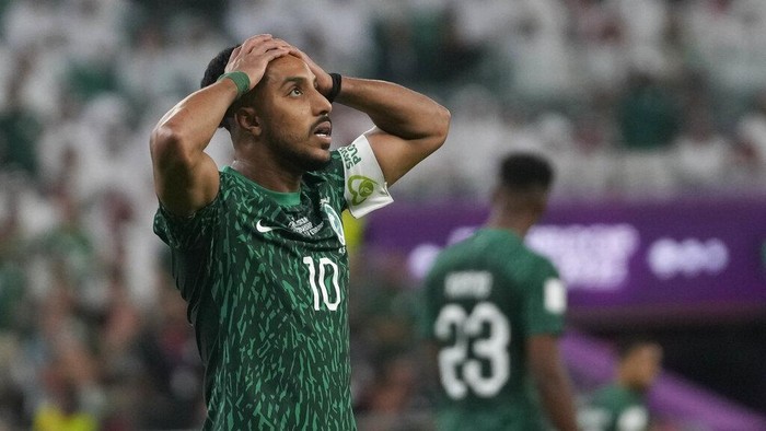 Saudi Arabias Salem Al-Dawsari holds his head after missing a chance to score during the World Cup group C soccer match between Poland and Saudi Arabia, at the Education City Stadium in Al Rayyan , Qatar, Saturday, Nov. 26, 2022. (AP Photo/Darko Vojinovic)