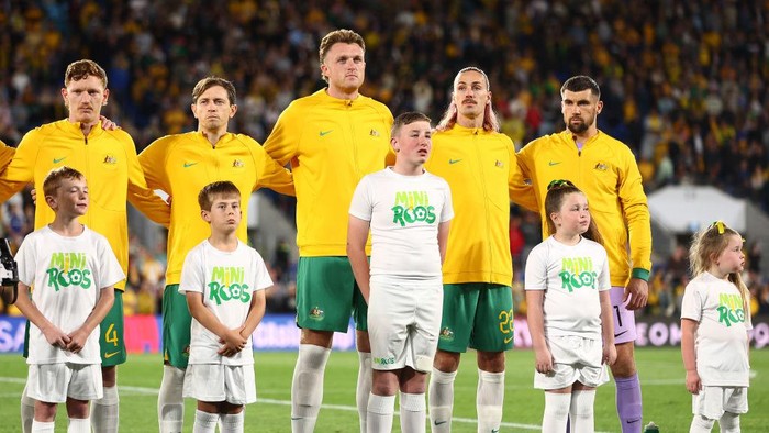 GOLD COAST, AUSTRALIA - SEPTEMBER 05: The Socceroos stand and sing the national anthem before the round three 2026 FIFA World Cup AFC Asian Qualifier match between Australia Socceroos and Bahrain at Robina Stadium on September 05, 2024 in Gold Coast, Australia. (Photo by Chris Hyde/Getty Images)