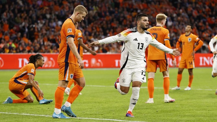 AMSTERDAM - (l-r) Nathan Ake of Holland, Matthijs De Ligt of Holland balks, Deniz Undav of Germany celebrates 1-1 during the UEFA Nations League match between the Netherlands and Germany at the Johan Cruyff ArenA on Sept. 10, 2024 in Amsterdam, Netherlands. ANP MAURICE VAN STEEN (Photo by ANP via Getty Images)