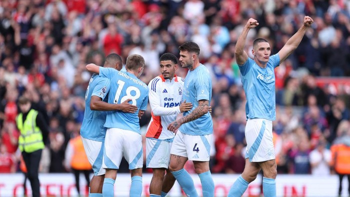 LIVERPOOL, ENGLAND - SEPTEMBER 14: Nikola Milenkovic of  Nottingham Forest celebrates with team mates after the Premier League match between Liverpool FC and Nottingham Forest FC at Anfield on September 14, 2024 in Liverpool, England. (Photo by Alex Livesey - Danehouse/Getty Images)