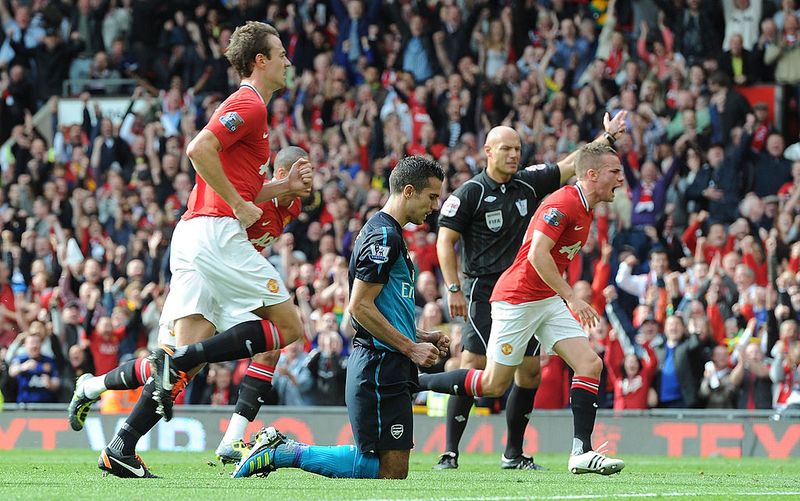 MANCHESTER, ENGLAND - AUGUST 28:  Robin van Persie of Arsenal looks dejected after missing a penalty during the Barclays Premier League match between Manchester United and Arsenal at Old Trafford on August 28, 2011 in Manchester, England. (Photo by Stuart MacFarlane/Arsenal FC via Getty Images)