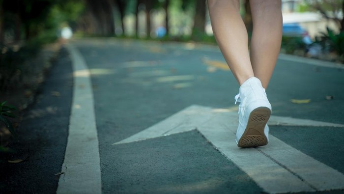 A close up of the girls shoes walking close up.