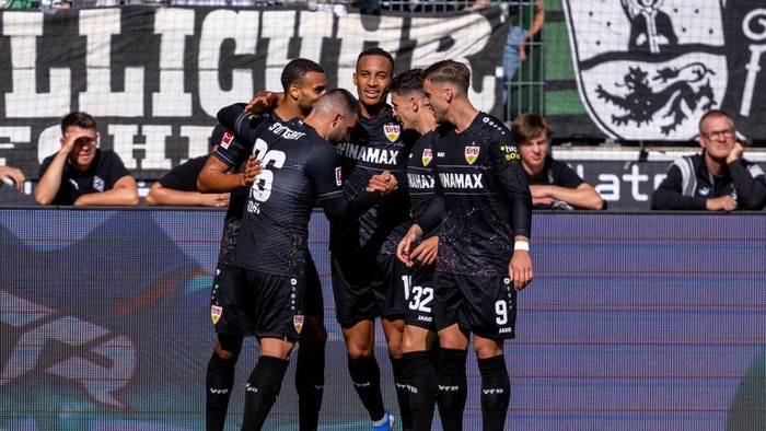 14 September 2024, North Rhine-Westphalia, Mönchengladbach: Soccer: Bundesliga, Borussia Mönchengladbach - VfB Stuttgart, Matchday 3, Borussia-Park stadium: Stuttgarts Deniz Undav (2nd from left) celebrates his goal for 0:1 with his teammates. Photo: David Inderlied/dpa - IMPORTANT NOTE: In accordance with the regulations of the DFL German Football League and the DFB German Football Association, it is prohibited to utilize or have utilized photographs taken in the stadium and/or of the match in the form of sequential images and/or video-like photo series. (Photo by David Inderlied/picture alliance via Getty Images)