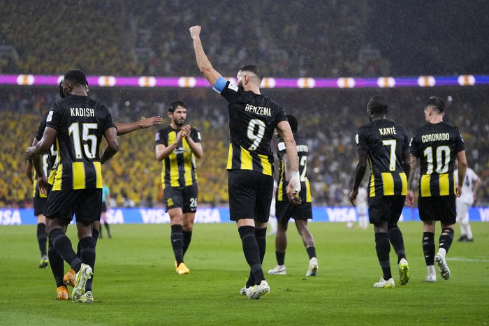 Al Ittihads Karim Benzema celebrates after scoring his sides third goal during the Soccer Club World Cup first round soccer match between Al Ittihad and Auckland City FC at King Abdullah Sports City stadium in Jeddah, Saudi Arabia, Tuesday, Dec. 12, 2023. Al Ittihad won 3-0. (AP Photo/Manu Fernandez)