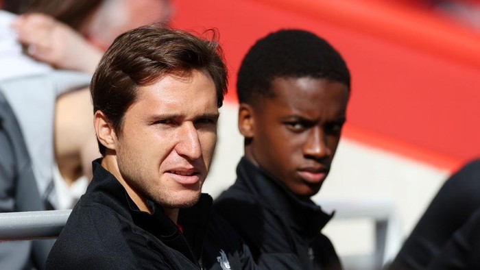 LIVERPOOL, ENGLAND - SEPTEMBER 14: Federico Chiesa of Liverpool looks on from the bench during the Premier League match between Liverpool FC and Nottingham Forest FC at Anfield on September 14, 2024 in Liverpool, England. (Photo by Carl Recine/Getty Images)