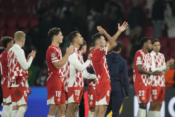 Gironas players leave the pitch after they lost the Champions League opening phase soccer match between Paris Saint-Germain and Girona at the Parc des Princes stadium in Paris, France, Wednesday, Sept. 18, 2024. (AP Photo/Christophe Ena)