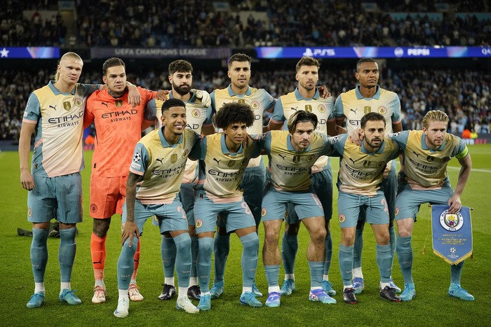 Manchester City team players pose prior to the start of the Champions League opening phase soccer match between Manchester City and Inter Milan at the Etihad Stadium, in Manchester, England, Wednesday, Sept. 18, 2024. (AP Photo/Dave Thompson)