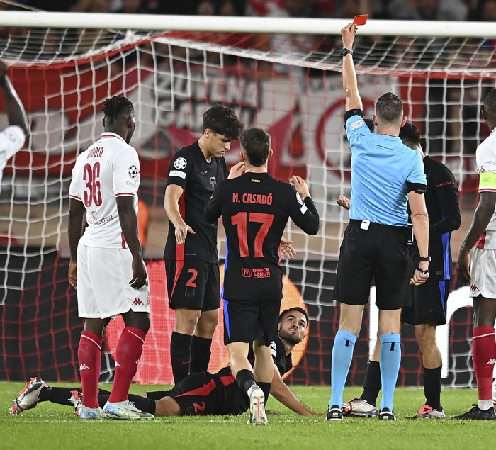 MONACO, MONACO - SEPTEMBER 19: Eric Garcia of FC Barcelona is shown a red card and sent off by Referee Allard Lindhout during the UEFA Champions League 2024/25 League Phase MD1 match between AS Monaco and FC Barcelona at Stade Louis II on September 19, 2024 in Monaco, Monaco. (Photo by Neal Simpson/Allstar/Getty Images)