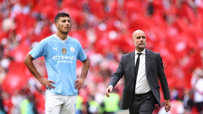 LONDON, ENGLAND - MAY 25: Manchester City manager Pep Guardiola and Rodri of Manchester City look dejected after full time during the Emirates FA Cup Final match between Manchester City and Manchester United at Wembley Stadium on May 25, 2024 in London, England.(Photo by Jacques Feeney/Offside/Offside via Getty Images)