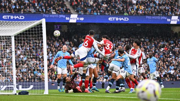  Gabriel of Arsenal scores his team's second goal past Ederson of Manchester City during the Premier League match between Manchester City FC and Arsenal FC at Etihad Stadium on September 22, 2024 in Manchester, England. (Photo by David Price/Arsenal FC via Getty Images)