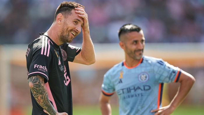 NEW YORK, NEW YORK - SEPTEMBER 21: Lionel Messi #10 of Inter Miami CF laughs while talking with Maximiliano Moralez #27 of New York City FC in the first half at Yankee Stadium on September 21, 2024 in New York City. (Photo by Vincent Carchietta/Getty Images)