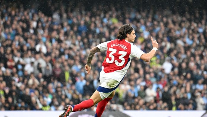 MANCHESTER, ENGLAND - SEPTEMBER 22: Riccardo Calafiori of Arsenal celebrates scoring his teams first goal during the Premier League match between Manchester City FC and Arsenal FC at Etihad Stadium on September 22, 2024 in Manchester, England. (Photo by David Price/Arsenal FC via Getty Images)