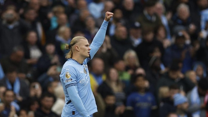 Soccer Football - Premier League - Manchester City v Arsenal - Etihad Stadium, Manchester, Britain - September 22, 2024 Manchester Citys Erling Haaland celebrates scoring their first goal Action Images via Reuters/Jason Cairnduff EDITORIAL USE ONLY. NO USE WITH UNAUTHORIZED AUDIO, VIDEO, DATA, FIXTURE LISTS, CLUB/LEAGUE LOGOS OR LIVE SERVICES. ONLINE IN-MATCH USE LIMITED TO 120 IMAGES, NO VIDEO EMULATION. NO USE IN BETTING, GAMES OR SINGLE CLUB/LEAGUE/PLAYER PUBLICATIONS. PLEASE CONTACT YOUR ACCOUNT REPRESENTATIVE FOR FURTHER DETAILS..