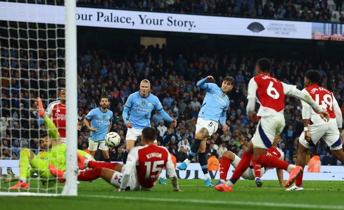 SOCCER-ENGLAND-MCI-ARS/REPORT Soccer Football - Premier League - Manchester City v Arsenal - Etihad Stadium, Manchester, Britain - September 22, 2024 Manchester City's John Stones scores their second goal REUTERS/Molly Darlington EDITORIAL USE ONLY. NO USE WITH UNAUTHORIZED AUDIO, VIDEO, DATA, FIXTURE LISTS, CLUB/LEAGUE LOGOS OR 'LIVE' SERVICES. ONLINE IN-MATCH USE LIMITED TO 120 IMAGES, NO VIDEO EMULATION. NO USE IN BETTING, GAMES OR SINGLE CLUB/LEAGUE/PLAYER PUBLICATIONS. PLEASE CONTACT YOUR ACCOUNT REPRESENTATIVE FOR FURTHER DETAILS.. TPX IMAGES OF THE DAY