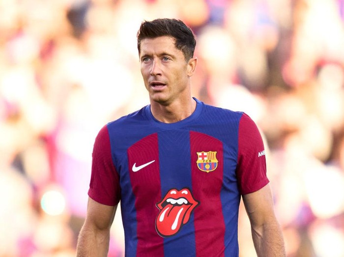 BARCELONA, SPAIN - OCTOBER 28: Robert Lewandowski of FC Barcelona looks on whilst wearing the limited edition FC Barcelona match shirt featuring the Rolling Stones logo during the LaLiga EA Sports match between FC Barcelona and Real Madrid CF at Estadi Olimpic Lluis Companys on October 28, 2023 in Barcelona, Spain. (Photo by Alex Caparros/Getty Images)