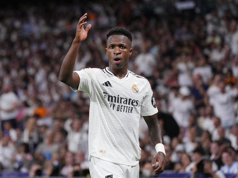 Real Madrid's Vinicius Junior gestures during the Champions League opening phase soccer match between Real Madrid and VfB Stuttgart at the Santiago Bernabeu stadium, in Madrid, Tuesday, Sept. 17, 2024. (AP Photo/Manu Fernandez)