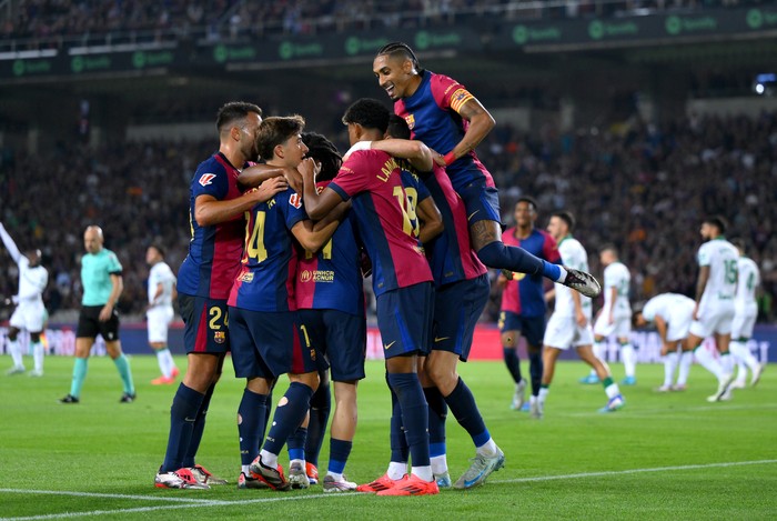 2174482549 BARCELONA, SPAIN - SEPTEMBER 25: Robert Lewandowski of FC Barcelona (obscured) celebrates scoring his team's first goal with teammates during the La Liga EA Sports match between FC Barcelona and Getafe CF at Camp Nou on September 25, 2024 in Barcelona, Spain. (Photo by David Ramos/Getty Images)
