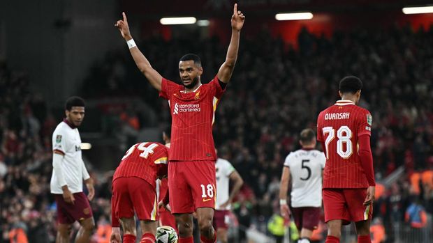 Liverpool's Dutch striker #18 Cody Gakpo reacts after scoring a goal during the English League Cup third round football match between Liverpool and West Ham United at Anfield in Liverpool, north west England on September 25, 2024. (Photo by Paul ELLIS / AFP) / RESTRICTED TO EDITORIAL USE. No use with unauthorized audio, video, data, fixture lists, club/league logos or 'live' services. Online in-match use limited to 120 images. An additional 40 images may be used in extra time. No video emulation. Social media in-match use limited to 120 images. An additional 40 images may be used in extra time. No use in betting publications, games or single club/league/player publications. /