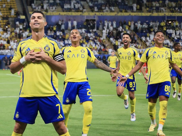 RIYADH, SAUDI ARABIA - SEPTEMBER 27: Cristiano Ronaldo of Al-Nassr celebrates scoring his side's second goal during the Saudi Pro League match between Al Nassr FC v Al-Wehda FC at Al-Awwal Stadium on September 27, 2024 in Riyadh, Saudi Arabia. (Photo by Al Nassr FC/Al Nassr FC via Getty Images)