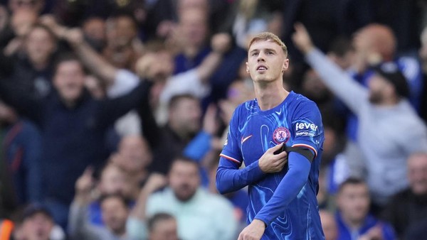 Chelseas Cole Palmer celebrates after scoring his sides 3rd goal during a British Premier League soccer match between Chelsea and Brighton at Stamford Bridge, London, Saturday, Sept. 28, 2024. (AP Photo/Kin Cheung)