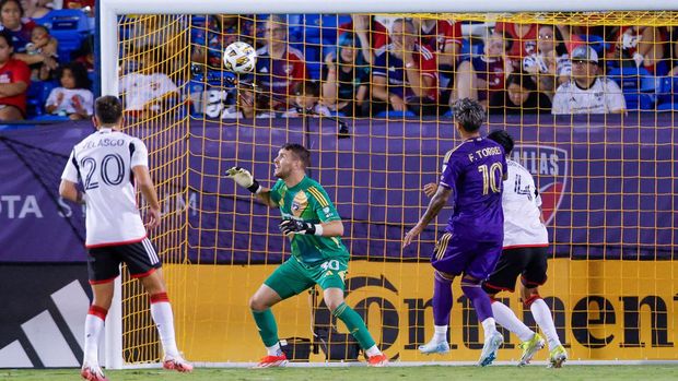 Sep 28, 2024; Frisco, Texas, USA; Orlando City scores a goal against FC Dallas goalkeeper Maarten Paes (30) during the first half at Toyota Stadium. Mandatory Credit: Andrew Dieb-Imagn Images