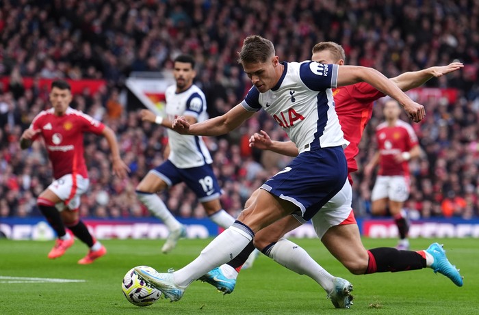 Tottenham Hotspurs Micky van de Ven provides the assist for Tottenham Hotspurs first goal of the game scored by Brennan Johnson, during the Premier League match at Old Trafford, Manchester. Picture date: Sunday September 29, 2024. (Photo by Martin Rickett/PA Images via Getty Images)