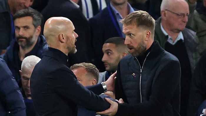 Manchester Uniteds Dutch manager Erik ten Hag (L) and Chelseas English head coach Graham Potter (R) shake hands after the English Premier League football match between Chelsea and Manchester United at Stamford Bridge in London on October 22, 2022. (Photo by ADRIAN DENNIS / AFP) / RESTRICTED TO EDITORIAL USE. No use with unauthorized audio, video, data, fixture lists, club/league logos or live services. Online in-match use limited to 120 images. An additional 40 images may be used in extra time. No video emulation. Social media in-match use limited to 120 images. An additional 40 images may be used in extra time. No use in betting publications, games or single club/league/player publications. /