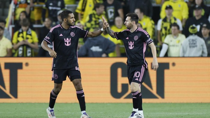 Inter Miamis Yannick Bright, left, and Lionel Messi celebrate their goal against the Columbus Crew during the second half of an MLS soccer match, Wednesday, Oct. 2, 2024, in Columbus, Ohio. (AP Photo/Jay LaPrete)