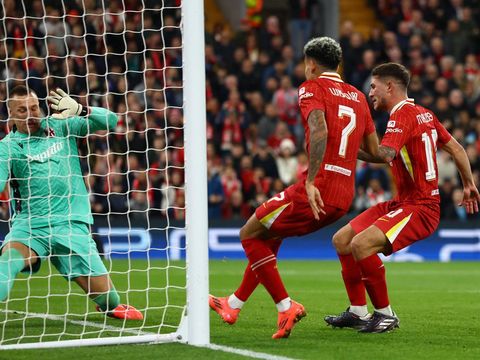 Soccer Football - Champions League - Liverpool v Bologna - Anfield, Liverpool, Britain - October 2, 2024 Liverpool's Alexis Mac Allister scores their first goal past Bologna's Lukasz Skorupski REUTERS/Molly Darlington
