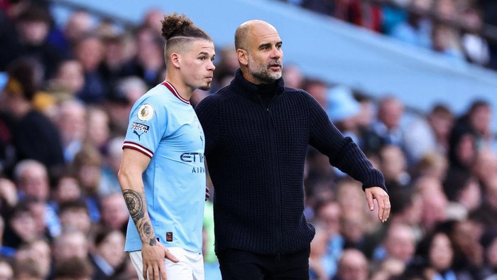 MANCHESTER, ENGLAND - APRIL 15: Kalvin Phillips of Manchester City and Pep Guardiola the head coach / manager of Manchester City during the Premier League match between Manchester City and Leicester City at Etihad Stadium on April 15, 2023 in Manchester, United Kingdom. (Photo by Robbie Jay Barratt - AMA/Getty Images)