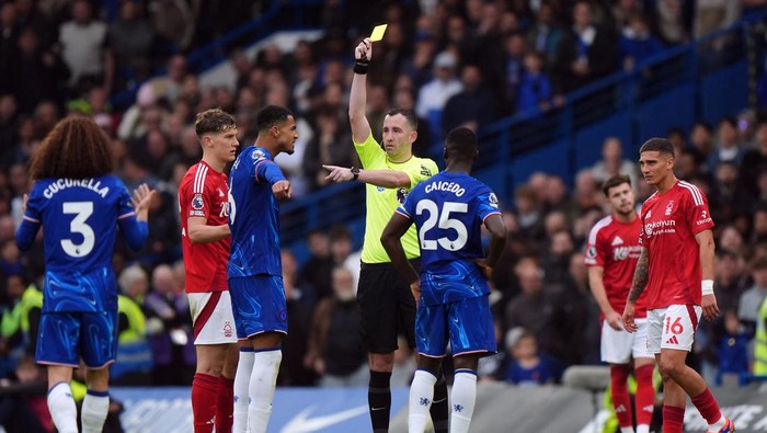 Referee Chris Kavanagh books Chelseas Levi Colwill during the Premier League match at Stamford Bridge, London. Picture date: Sunday October 6, 2024. (Photo by Bradley Collyer/PA Images via Getty Images)