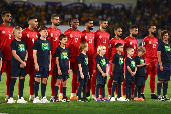 GOLD COAST, AUSTRALIA - SEPTEMBER 05: Members of Team Bahrain stand and sing the national anthem before the round three 2026 FIFA World Cup AFC Asian Qualifier match between Australia Socceroos and Bahrain at Robina Stadium on September 05, 2024 in Gold Coast, Australia. (Photo by Chris Hyde/Getty Images)