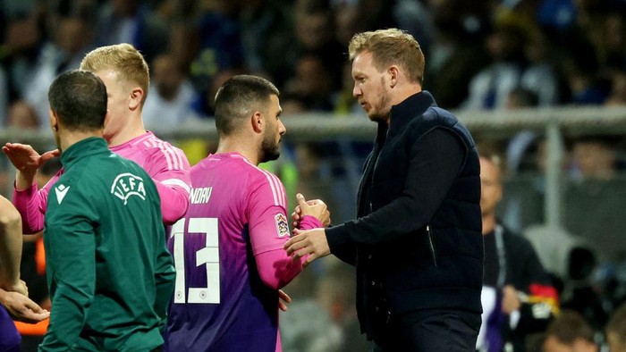11 October 2024, Bosnia-Herzegovina, Zenica: Soccer, Nations League A, Bosnia-Herzegovina - Germany, Group stage, Group 3, Matchday 3, Stadion Bilino Polje, Germany coach Julian Nagelsmann (r) congratulates Deniz Undav on his goals as he is substituted. Photo: Christian Charisius/dpa (Photo by Christian Charisius/picture alliance via Getty Images)