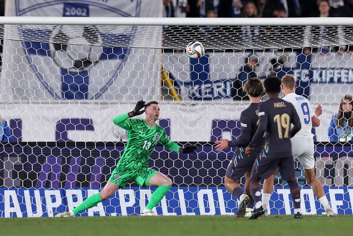 2178239293 HELSINKI, FINLAND - OCTOBER 13: Dean Henderson of England reaches for a shot from Fredrik Jensen of Finland during the UEFA Nations League 2024/25 League B Group B2 match between Finland and England at Helsinki Olympic Stadium on October 13, 2024 in Helsinki, Finland. (Photo by Eddie Keogh - The FA/The FA via Getty Images)