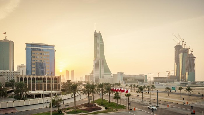 Ilustrasi Bahrain View over Bahrain Financial Harbour, Modern Business Skyscrapers during sunset. Bahrain Financial Harbour, Sea Front, Manama, Bahrain, Middle East.