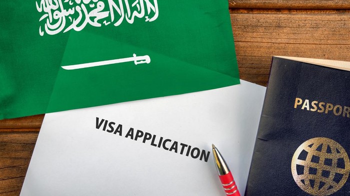 passport and flag of Saudi Arabia