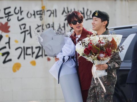K-pop boy band BTS member J-Hope is greeted by fellow BTS member Jin, after being discharged from his 18 months of mandatory military service, outside a military base in Wonju, South Korea, October 17, 2024. REUTERS/Kim Soo-hyeon